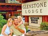 Guests in front of the Glenstone Lodge sign.