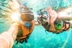 Two people wearing a snorkeling gears while snorkeling in Ft. Lauderdale/West Palm Beach while on Glass Bottom Boat and Snorkeling tour.
