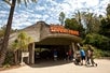The entrance to the San Diego Zoo Safari Park with several visitors entering the premises