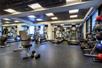 Fitness room with treadmills, and other cardio equipment and weights.