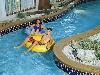Guests on the inner tube enjoying the lazy river at Grand Country Inn Indoor and Outdoor Water Park in Branson, Missouri.