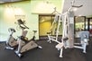Fitness room with cardio and weight equipment.