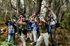 The group all looking through their binoculars on the Hakalau Birdwatching Tour in Kona Hawaii, USA.
