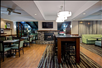 Breakfast dining area with fireplace and flat-screen TV.