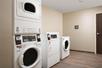 Guest laundry with washing machines and a dryer.