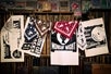 Bandanas and black and white prints hanging up at the shop