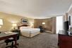 Guest room with 1 king bed at Hilton DFW Lakes Executive Conference Center, Grapevine, TX.