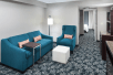 Living area with soft seating inside a guest room at Hilton Garden Inn Cincinnati/Mason, OH.