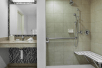 Accessible shower inside a private bathroom at Hilton Garden Inn Schaumburg, IL.