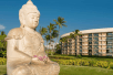 Exterior view of the hotel with a statue.