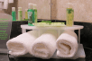 Fresh towels and complimentary toiletries inside a private bathroom at Holiday Inn Express Hotel & Suites Kodak East-Sevierville, an IHG Hotel, TN. 