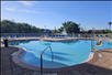 Outdoor pool overlooking a water fountain.