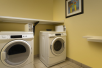 Laundry room equipped with washer and dryer.