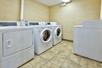 Guest laundry equipped with washers and dryers.