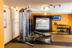 Fitness center with free weights and other gym equipment.