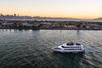 Aerial view of the Alive After Five Happy Hour Cruise at sunset with San Francisco in the background.