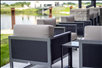 Outdoor seating with view of the pond.