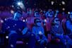 A theatre full of parents and children wearing 3D glasses and laughing at LEGOLAND® Discovery Center Atlanta.