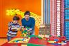 A mother and son playing with LEGO at LEGOLAND® Discovery Center in Columbus, Ohio.