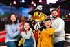 A family posing for a picture with a LEGO pirate at LEGOLAND® Discovery Center in Columbus, Ohio.
