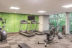 Fitness center with treadmills, elliptical trainer, and other gym equipment.