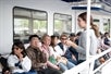 Tourists listening to their guide while on board