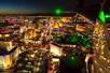 Aerial view of the Las Vegas strip at night with hotel and casino lights illuminating the city on a Maverick helicopter tour.