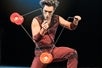 Elan Diabolos juggling on stage at the Broadway Theater.