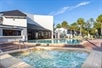 Outdoor hot tub and pool at Legacy Vacation Resorts.