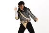 Michael Knight dressed in an iconic black and gold Michael Jackson costume striking a pose with a white background.