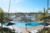 Outdoor pool with waterfront views of the marina.