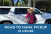 A woman in a big hat smiling in front of a white SUV and a box saying "Road to Hana Pickup 10 Hours" with Maui Pickup in Maui, Hawaii, USA.