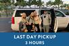 A family standing in front of a white SUV and a blue box saying "Last Day Pickup 3 Hours" with Maui Pickup in Maui, Hawaii, USA.