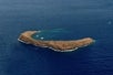 A small crescent rock formation off the coast of Maui seen from the sky on the Maui Spectacular Helicopter Tour in Hawaii USA.
