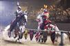 Two knights ride horses as they battle in the middle of the arena