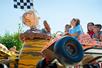 Children laughing while riding Pigpen's Mud Buggies at Michigan's Adventure in Grand Rapids, Michigan.