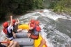 A view from the back of a raft, floating downstream