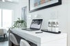 Desk/table with two chairs inside the studio.