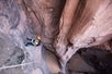 A person rappeling into this chasm on the Moab Canyoneering Adventure Moab Utah.