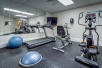 Fitness center with treadmill, elliptical trainer, and exercise bike.