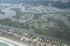 Aerial view looking down on Murrells Inlet Garden City  on a sunny day.
