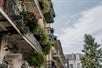 A building with balconies and plants all over on the New Orleans: Secrets & Highlights of the French Quarter Tour in New Orleans, Louisiana, USA.
