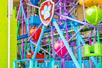 The Paw Patrol team sitting under a colorful small Ferris wheel at Nickelodeon Universe at American Dream in Newark, New Jersey, USA.