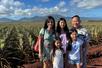 A family posed at the vast Royal Hawaiian Farm, an iconic Dole Pineapple fields in Wahiawa.