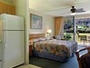 Kitchen, refrigerator, stovetop, 1 king bed at Outrigger Napili Shores, HI.