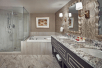Fresh towels, bathtub, glass-enclosed shower inside a private bathroom at Paris Las Vegas, NV.