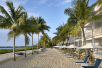 Beach with chairs and palm trees at Parrot Key Hotel & Villas in Key West.  