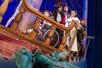 The cast of Peter Pan Goes Wrong on a ship with an crocodile below them in New York, New York