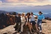 The tour group taking photos next to a cliff with Pink Jeep Tours in Pigeon Forge, Tennessee