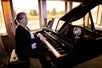 The pianist playing some wonderful music during the Dinner Cruise on Portland Spirit, Portland, Oregon.